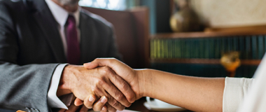 Two employees shaking hands