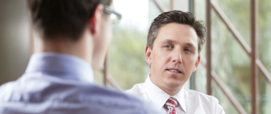 Two employees talking in the office