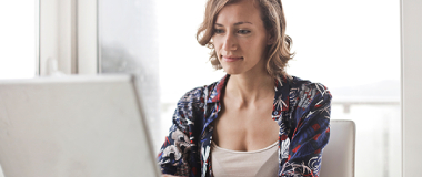 resume help adelaide A woman working at her home on the laptop
