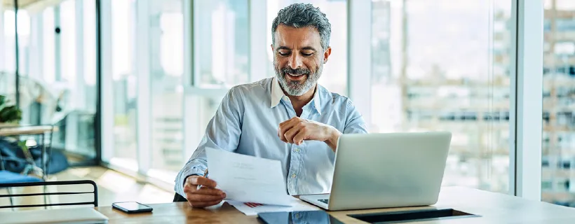 a man looking at a piece of paper