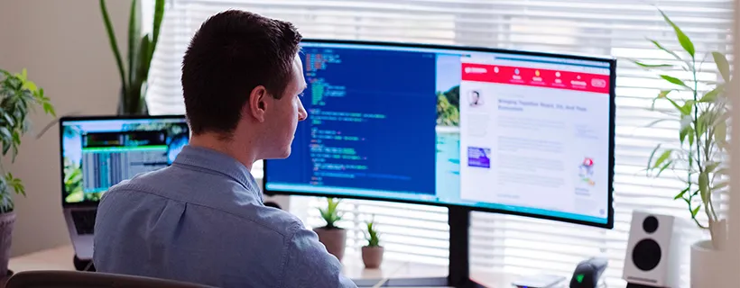 A man working at his desk from home