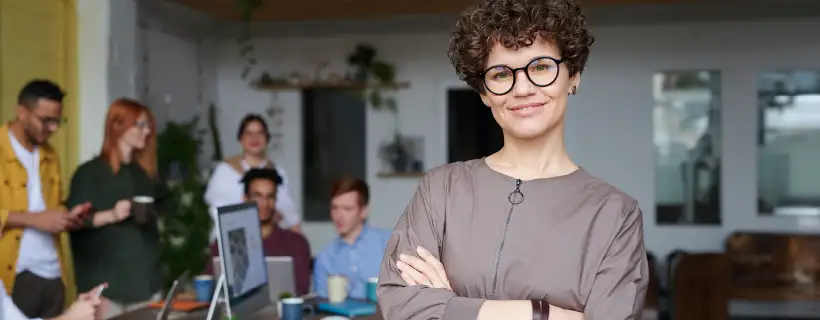 a young professional with glasses standing 