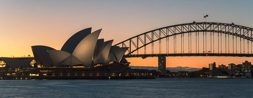 The Sydney Harbour on a clear day with boats and the Opera house