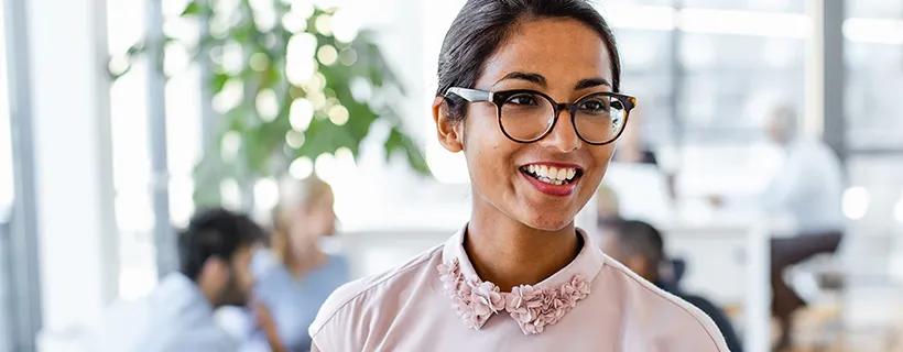 Woman with glasses in pink shirt