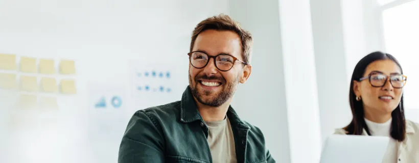 a young male professional smiling 