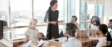 Employees in the meeting room in the office listening to a presentation