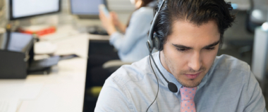 A man in a call centre on the phone