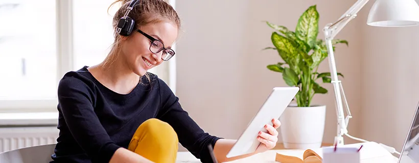 Girl wearing headset reading CV