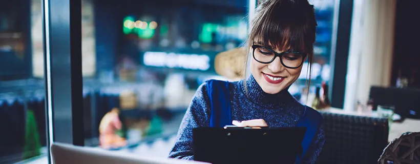 a lady smiling while working