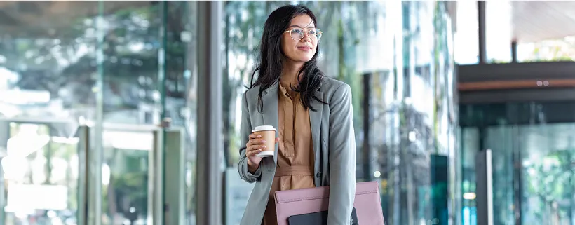 a female holding coffee