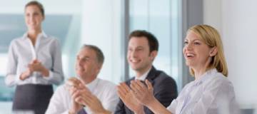 Employees applauding a successful pitch