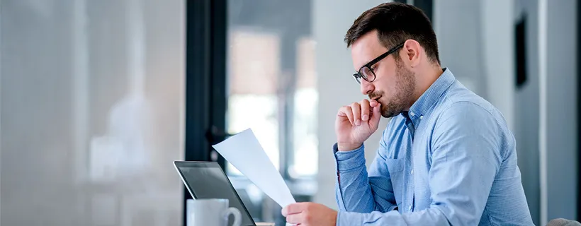 a Financial Analyst looking at a report