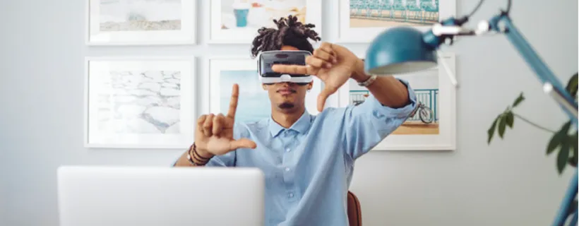 A man wearing virtual reality goggles