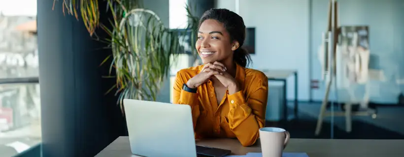 a young female professional looking outside the window