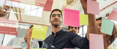 man working with his team