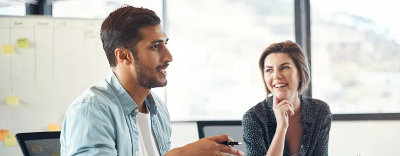 an office employee talking to a contractor in the office