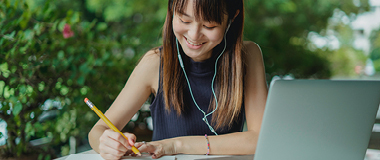 A girl working and laughing