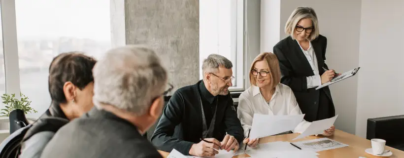 a group of people in a meeting