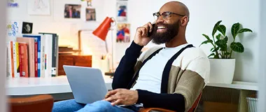 a man on the phone laughing