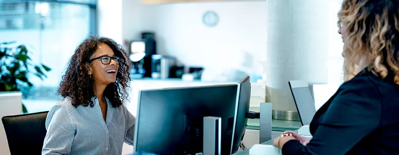 a Receptionist helping a customer