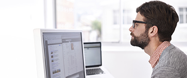 A man working in the office on his computer