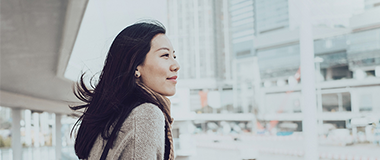 A woman staring out into the city