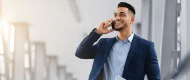 Employees laughing in a group meeting