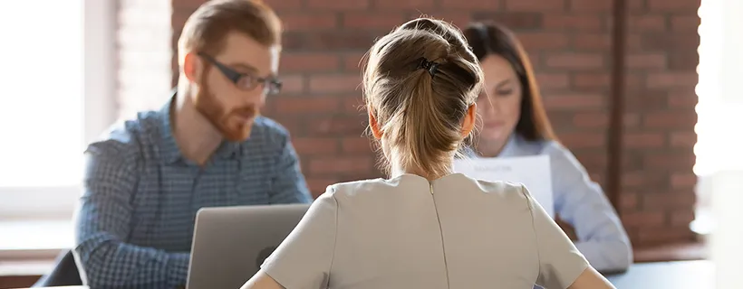 Three employees working together in the office