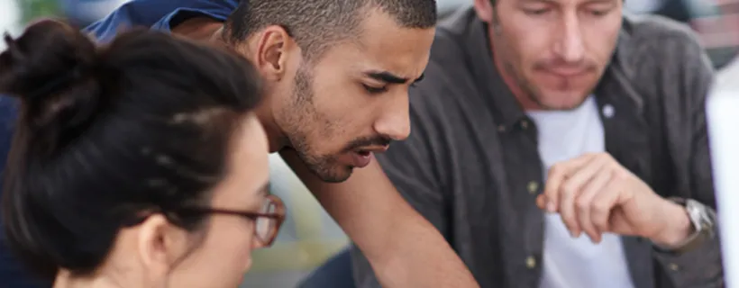 Three people working together in the office