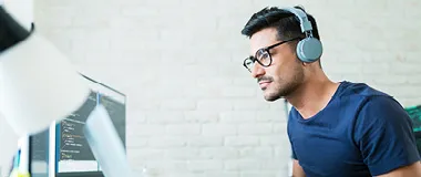 a guy looking at his computer