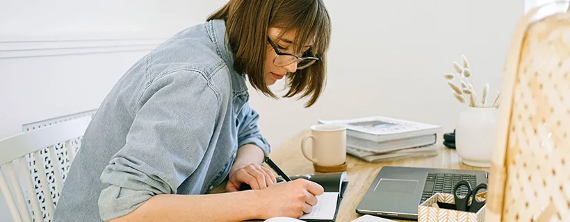 A woman working at her desk in the office