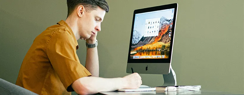 A man sitting at his desk working from home