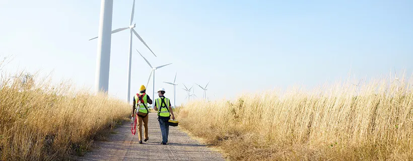 two workers in the field