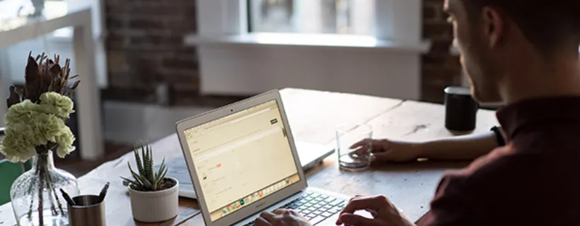 Employee working from home on his laptop