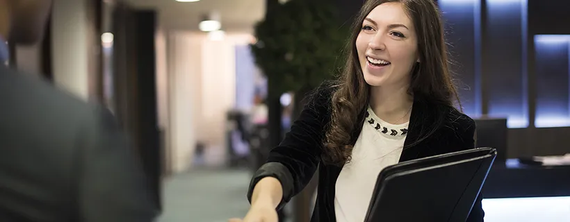 Salesperson shaking hands with client