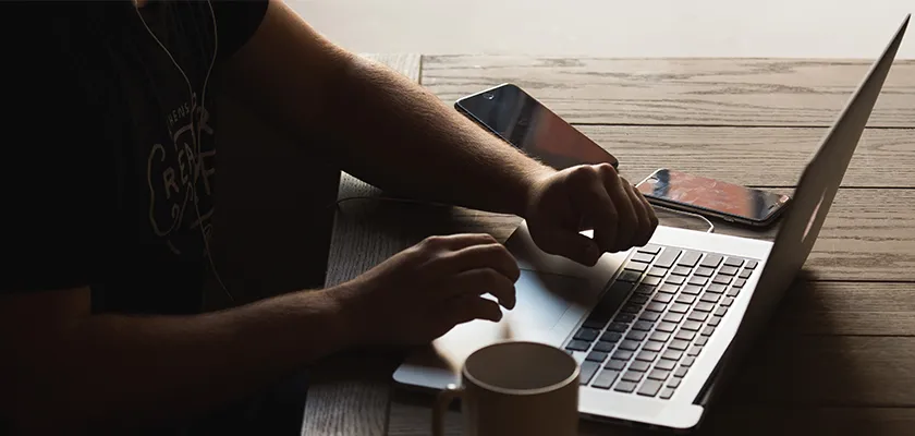 A man at his laptop working