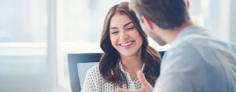 a male talking to his female colleague 