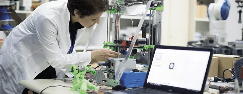 a scientist 3D printing in the laboratory