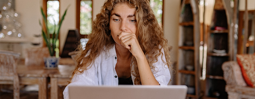 A woman working from home at her desk